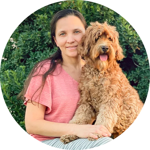 Tatyana, the breeder behind Adorable Labradoodle, holding one of her labradoodles