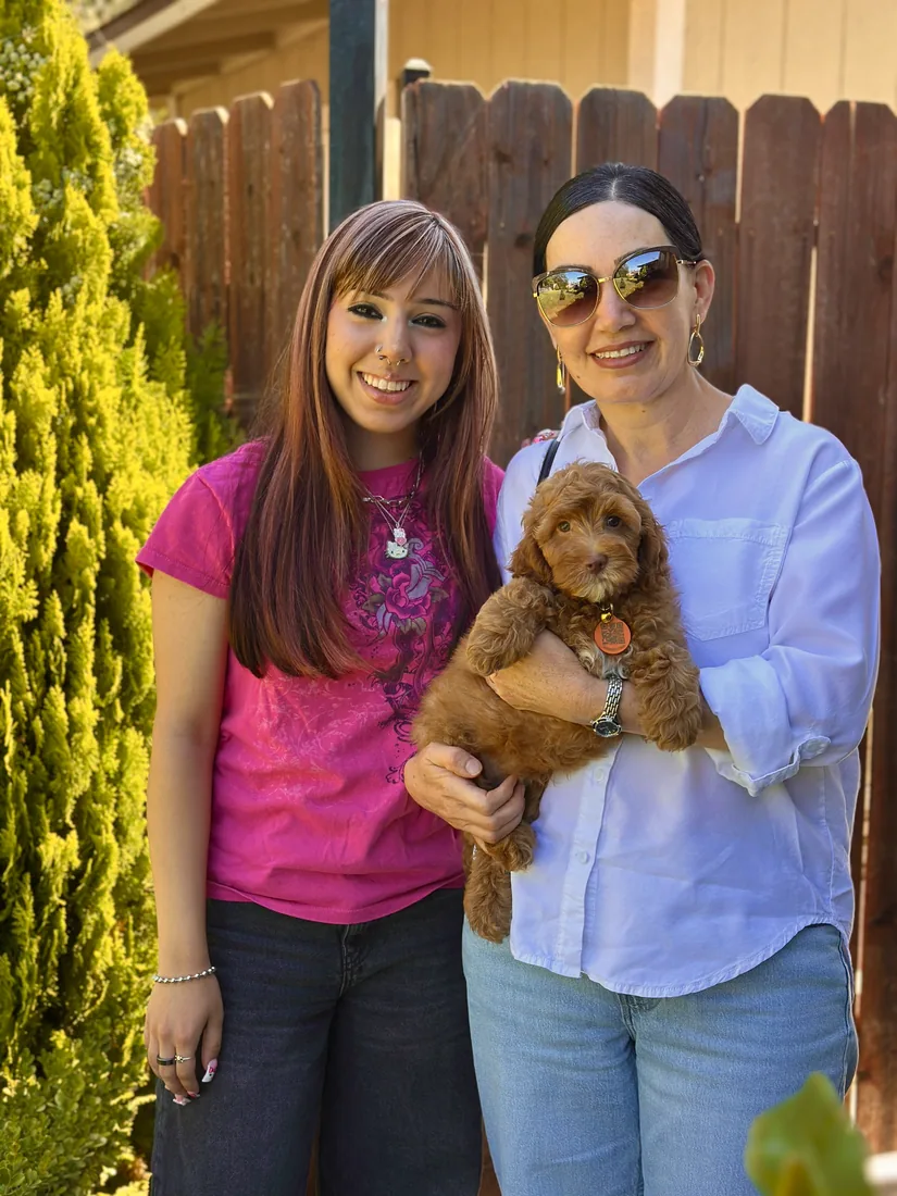 A family with their Adorable Labradoodle