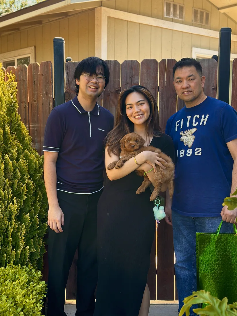 A family with their Adorable Labradoodle