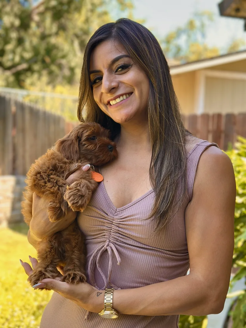 A family with their Adorable Labradoodle