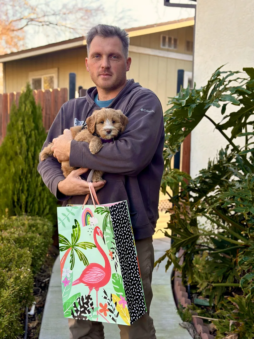 A family with their Adorable Labradoodle