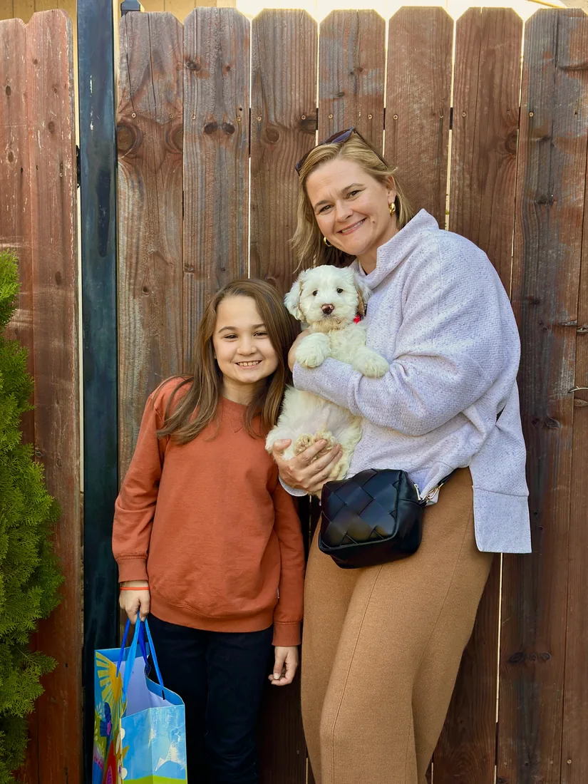 A family with their Adorable Labradoodle